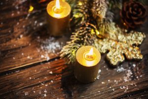 Christmas decoration with gold candles and light