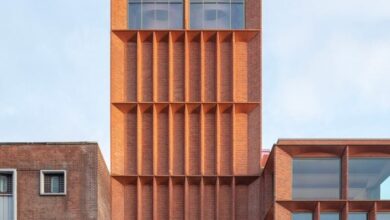 Photo of Niall McLaughlin Architects creates red-brick beacon for rugby museum