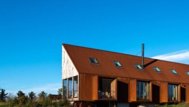 Photo of Kinneymorrow clads Berkshires Farmhouse in wood and weathering steel